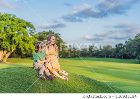 Heartwarming outdoor bonding as a pregnant mom and her son enjoy quality time together, savoring the beauty of nature and creating cherished moments Heartwarming outdoor bonding as a pregnant mom and her son enjoy quality time together, savoring the beauty of nature and creating cherished moments 110933184