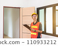 Professional men home Inspector surveyor wearing vests and hard hat at new house property 110933212