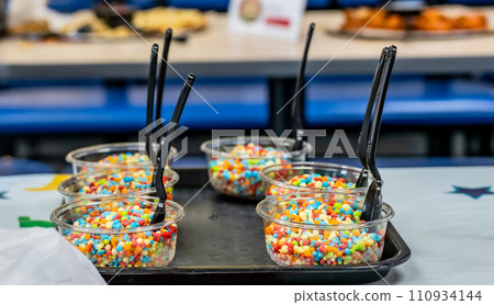 Flash frozen ice cream balls in a single serving cup tray for a party Flash frozen ice cream balls in a single serving cup tray for a party 110934144