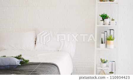 Blur background bedroom home interior in cozy decoration room. Clean soft bed stylish decor relax dorm with copy space. Modern apartment white light trendy style. Blurred background defocused indoors 110934423