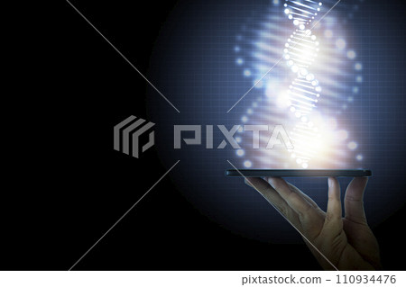 Close-up man's hand contained DNA molecules and gleaming light rose from his smartphone on blue background design. Genetics of living things. Concept of medical, treatment, science, discovery, biology 110934476