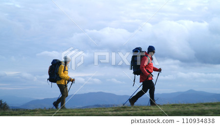 African American man with Caucasian woman walk in mountains 110934838