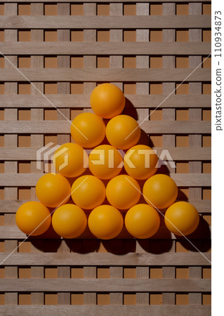 Abstract background with wooden grid and orange balls Abstract background with wooden grid and orange balls 110934873