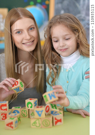 Portrait of little girl and her mother playing Portrait of little girl and her mother playing 110935115