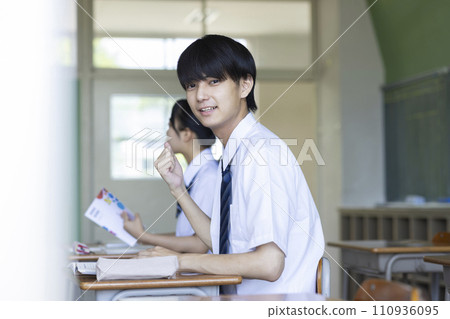 male student studying in the classroom male student studying in the classroom 110936095