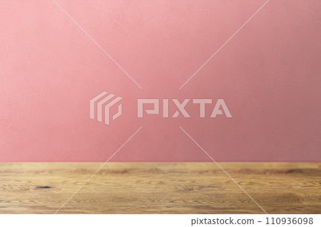 Natural wood table with wood grain and uneven pink wall background Natural wood table with wood grain and uneven pink wall background 110936098