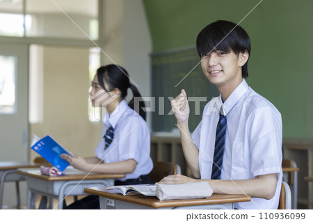 male student studying in the classroom male student studying in the classroom 110936099