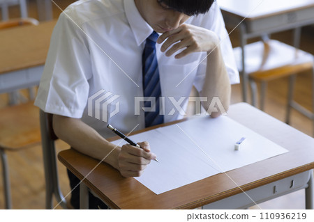 male student studying in the classroom male student studying in the classroom 110936219