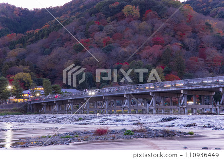 Evening scenery of Katsuragawa River and Togetsukyo Bridge in Kyoto [Autumn image] 110936449