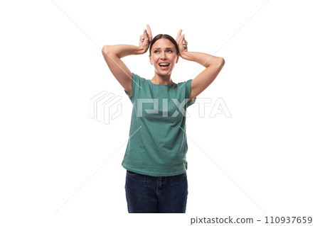 surprised young brunette woman dressed in green t-shirt and jeans surprised young brunette woman dressed in green t-shirt and jeans 110937659