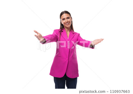 young smiling slender caucasian brunette boss woman in a pink jacket greets young smiling slender caucasian brunette boss woman in a pink jacket greets 110937663
