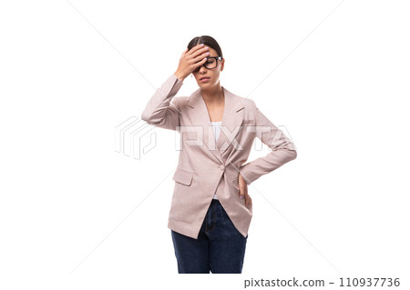 pretty 30 year old business woman with black hair wearing a beige jacket is having a headache pretty 30 year old business woman with black hair wearing a beige jacket is having a headache 110937736