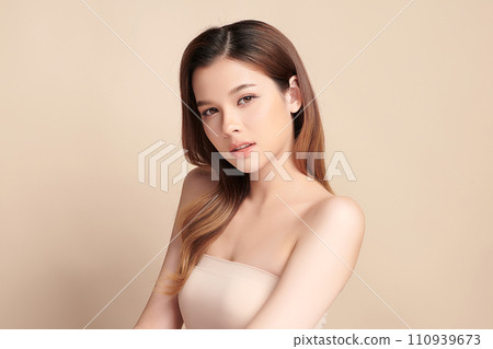 Beautiful young asian woman with clean fresh skin on beige background, Face care, Facial treatment, Cosmetology, beauty and spa, Asian women portrait. 110939673