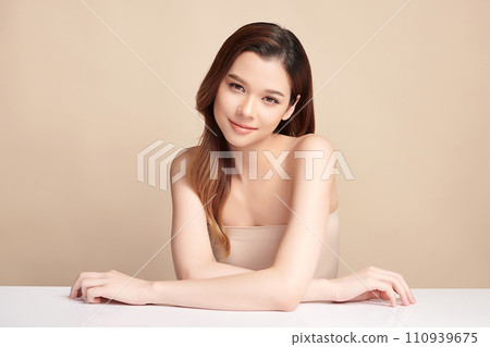 Beautiful young asian woman with clean fresh skin on beige background, Face care, Facial treatment, Cosmetology, beauty and spa, Asian women portrait. Beautiful young asian woman with clean fresh skin on beige background, Face care, Facial treatment, Cosmetology, beauty and spa, Asian women portrait. 110939675