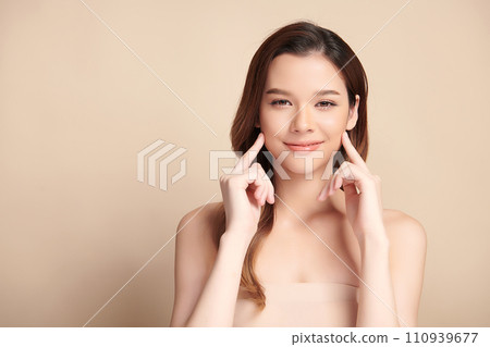 Beautiful young asian woman with clean fresh skin on beige background, Face care, Facial treatment, Cosmetology, beauty and spa, Asian women portrait. 110939677