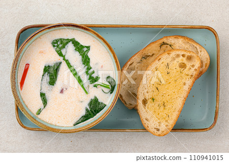 Portion of gourmet salmon creamy soup 110941015