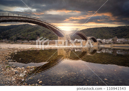 Large wooden bridge at sunset Kintaikyo bridge Iwakuni Large wooden bridge at sunset Kintaikyo bridge Iwakuni 110941543