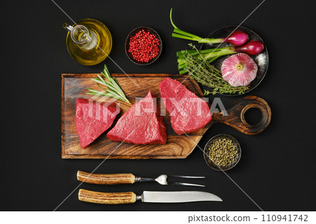 Overhead view of tri tip beef loin steak with spice and herbs 110941742