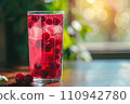 glass of cold red cocktail with ice 110942780