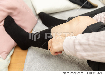 A woman's feet wearing socks A woman's feet wearing socks 110942821