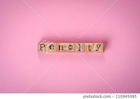 The inscription Penalty made up of wooden cubes on a plain background The inscription Penalty made up of wooden cubes on a plain background 110945095
