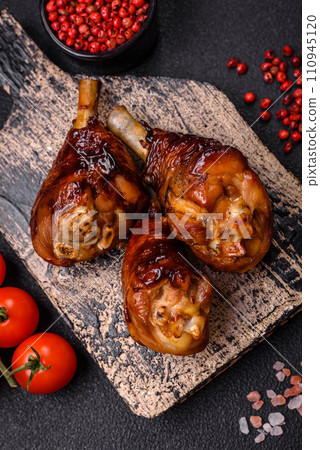 Delicious grilled chicken legs with spices and herbs in teriyaki sauce 110945120