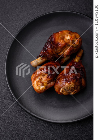 Delicious grilled chicken legs with spices and herbs in teriyaki sauce 110945130