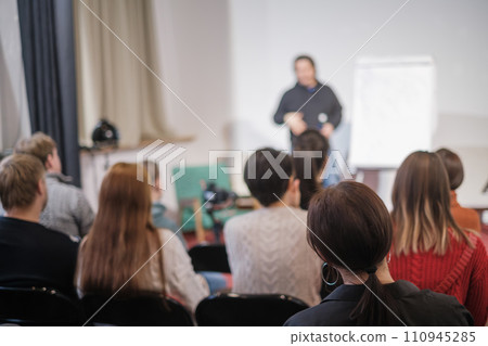 Engaged audience listening to male speaker at business workshop 110945285