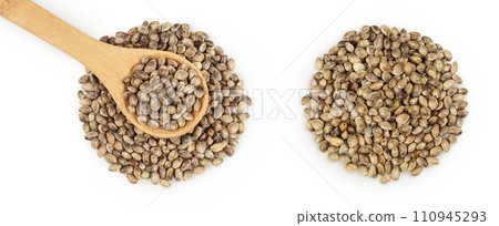 Hemp seeds in wooden spoon isolated on white background with full depth of field. Top view. Flat lay. Hemp seeds in wooden spoon isolated on white background with full depth of field. Top view. Flat lay. 110945293