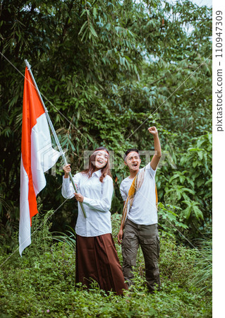 a handsome man with sarong standing together with a beautiful woman a handsome man with sarong standing together with a beautiful woman 110947309