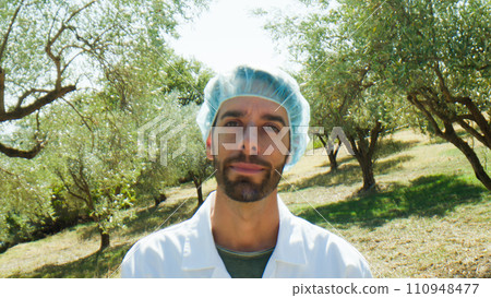 Agronomy in olive field. Close up. Agronomy in olive field. Close up. 110948477