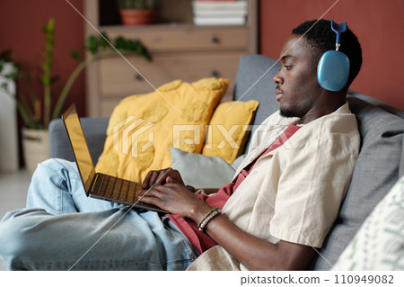 Young male blogger in headphones Young male blogger in headphones 110949082