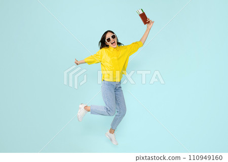 Glad excited young european woman tourist holding tickets and passport Glad excited young european woman tourist holding tickets and passport 110949160