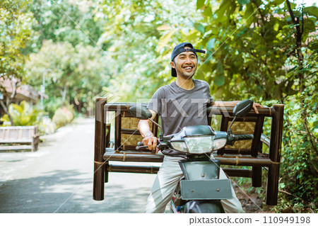 asian man selling bamboo chair carrying chair on motorcycle 110949198