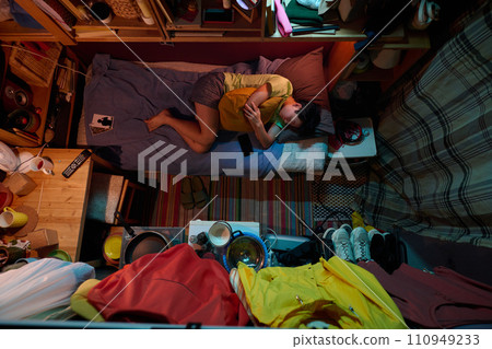 Napping on single bed in small apartment Napping on single bed in small apartment 110949233