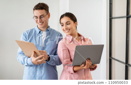 Glad professional confident millennial diverse people work with tablet, computer planning finance 110950033