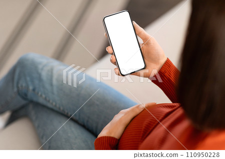 Unrecognizable Pregnant Woman Using Smartphone With Blank Screen At Home Unrecognizable Pregnant Woman Using Smartphone With Blank Screen At Home 110950228
