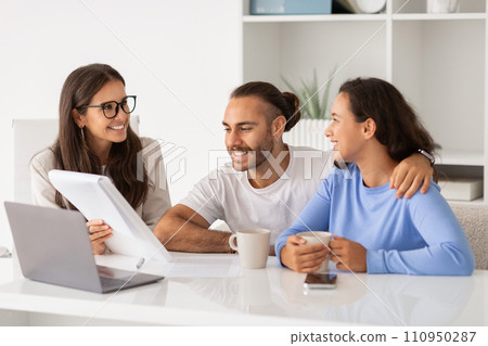 Expert advice. Thoughtful young couple listening to confident financial advisor 110950287
