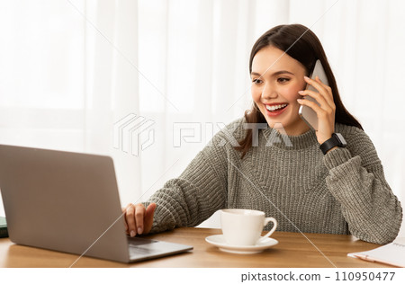 Young business lady working from home office, have phone call 110950477