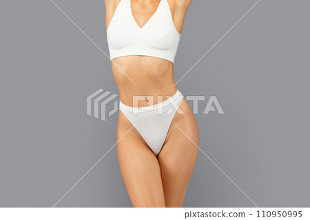 European slim millennial woman in white underwear show perfect body after weight loss European slim millennial woman in white underwear show perfect body after weight loss 110950995