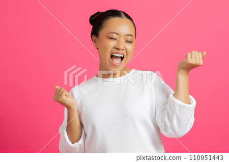 Big Luck. Happy Excited Asian Woman Celebrating Success On Pink Background Big Luck. Happy Excited Asian Woman Celebrating Success On Pink Background 110951443