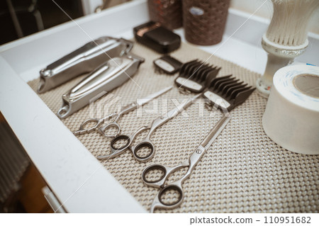 a set of barber equipment arranged on a table a set of barber equipment arranged on a table 110951682