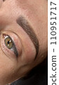 Close up view of beautiful brown female eye. Perfect trendy eyebrow. Good vision, contact lenses, brow bar or fashion eyebrow makeup concept 110951717