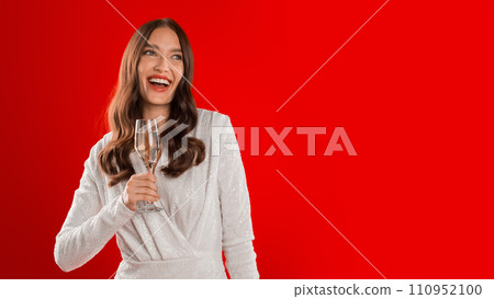 lady cheerfully toasting with wine glass on red studio background lady cheerfully toasting with wine glass on red studio background 110952100