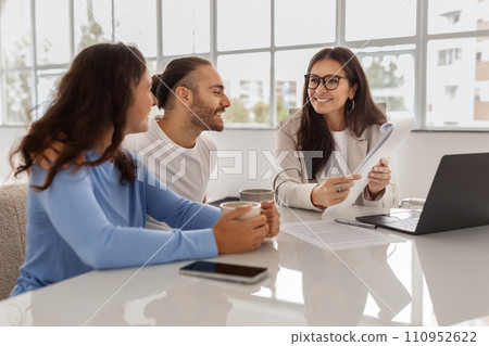 Happy Homebuyers. Spouses Having Consultation In Real Estate Agency Happy Homebuyers. Spouses Having Consultation In Real Estate Agency 110952622