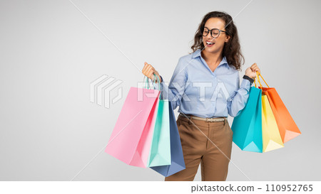 Cheerful millennial caucasian lady in formal wear, glasses with open mouth 110952765