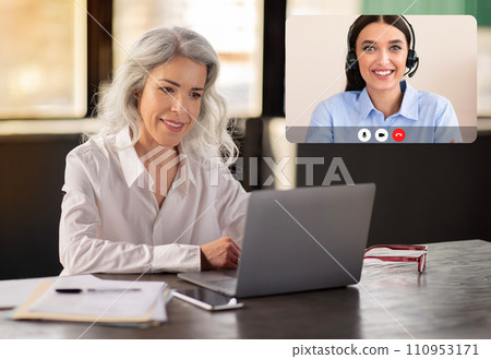 Mature Business Lady Using Laptop Computer Working Online In Office 110953171