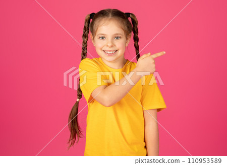 Free Place. Happy Cheerful Little Girl Pointing Aside With Finger 110953589