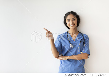Young Indian Doctor Woman In Blue Uniform Pointing At Copy Space 110953766