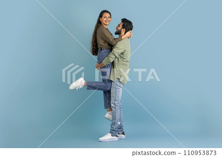 Loving indian guy lifting up his beautiful girlfriend 110953873